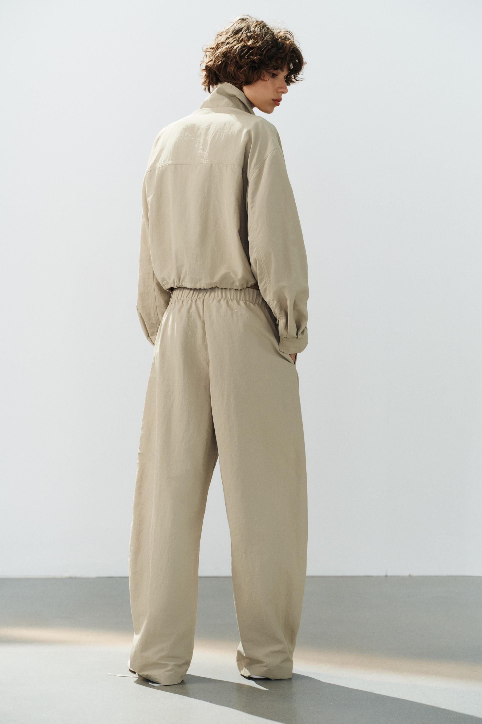 PANTALON EN TISSU TECHNIQUE ÉLASTIQUE